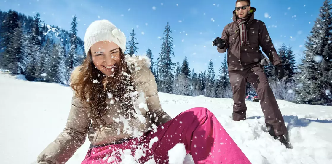 Couple playing in snow